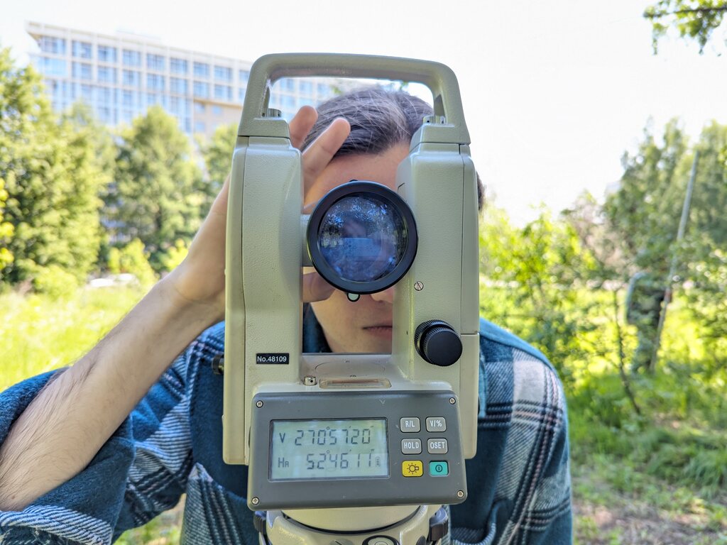 Engineer using a total station for land surveying